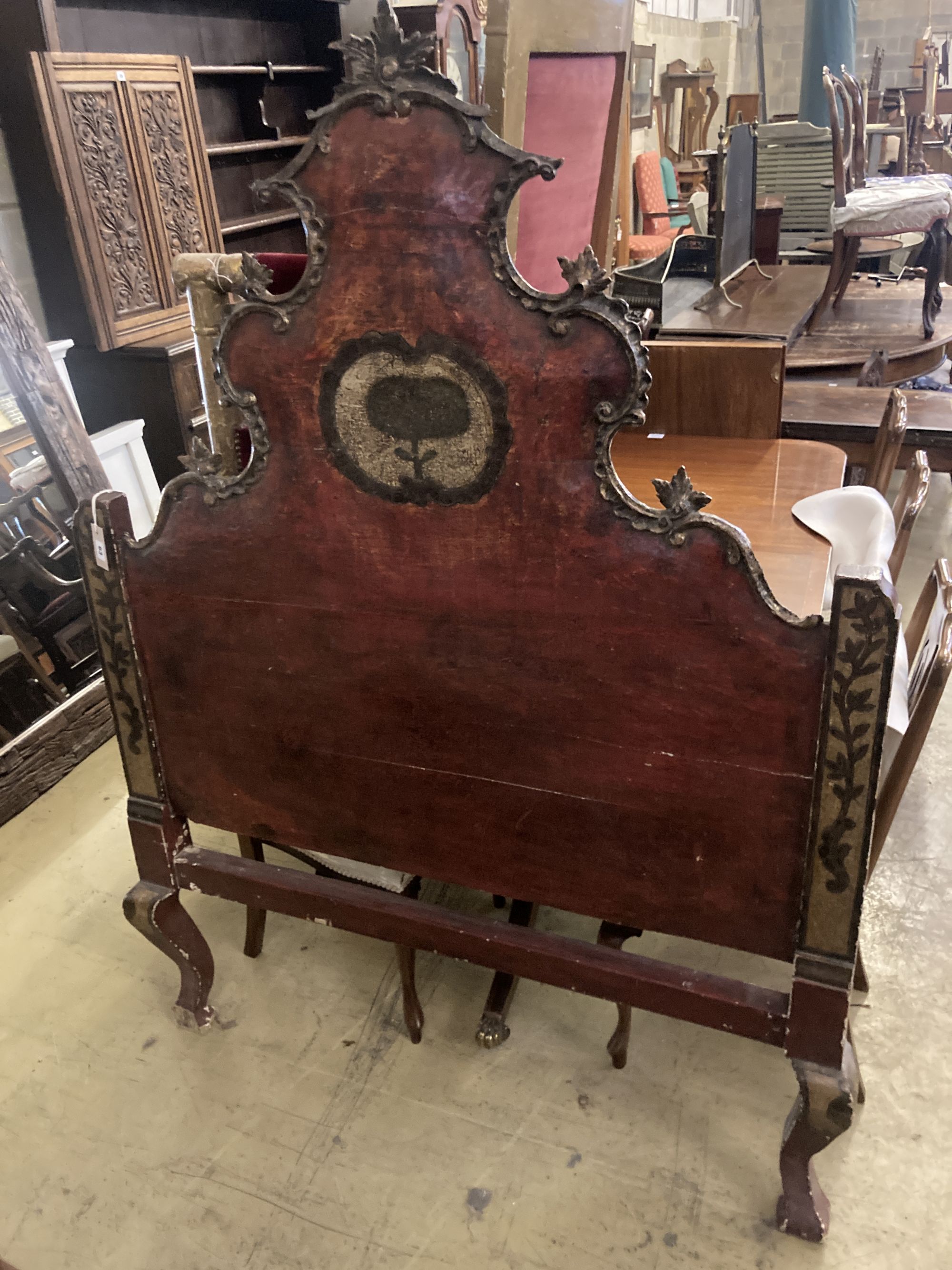 An 18th century painted headboard, width 124cm, height 170cm